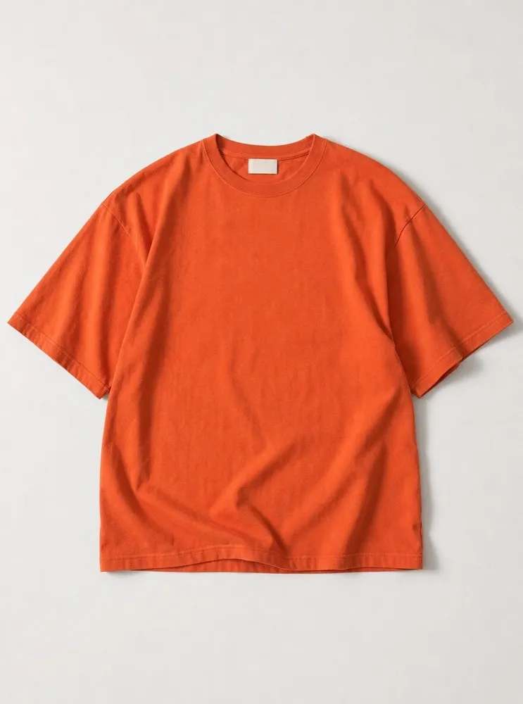 The Heavyweight Tee in Persimmon, laid flat